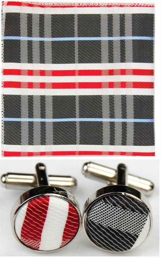 Cravate gris foncé avec mouchoir et boutonnière